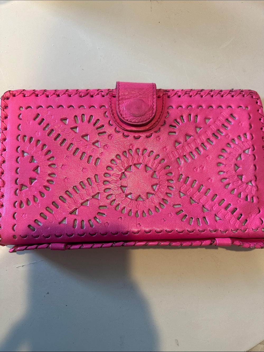 CLEOBELLA tooled clutch wallet.